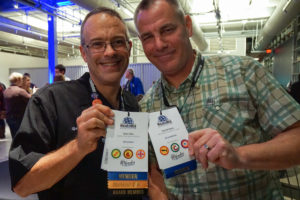 Attendees showing their badges.